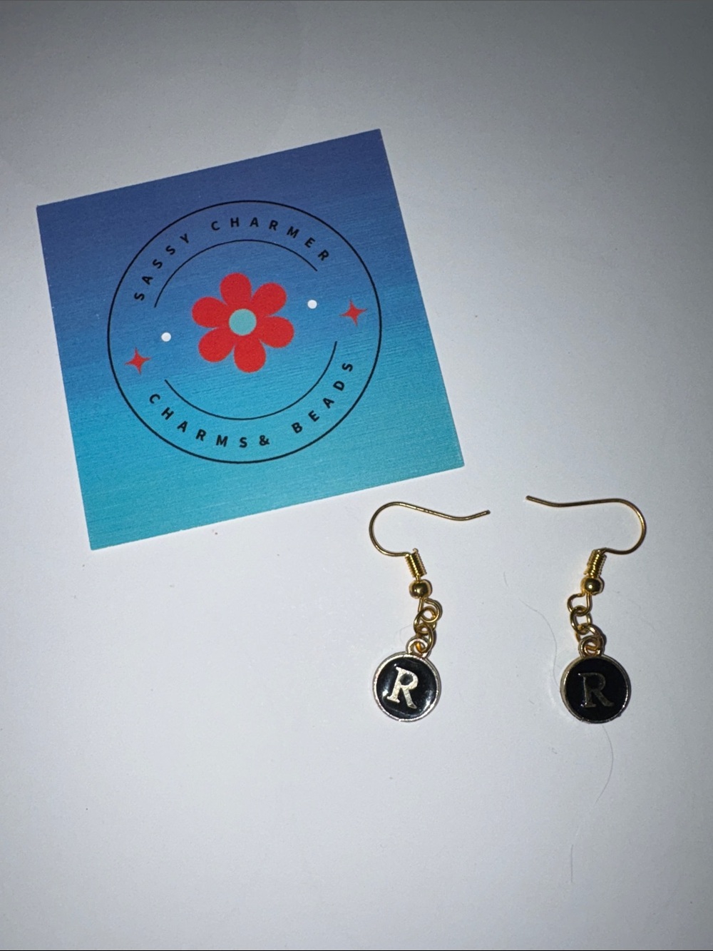 Sassy Charmer Gold and Black 'R' Initial Drop Earrings